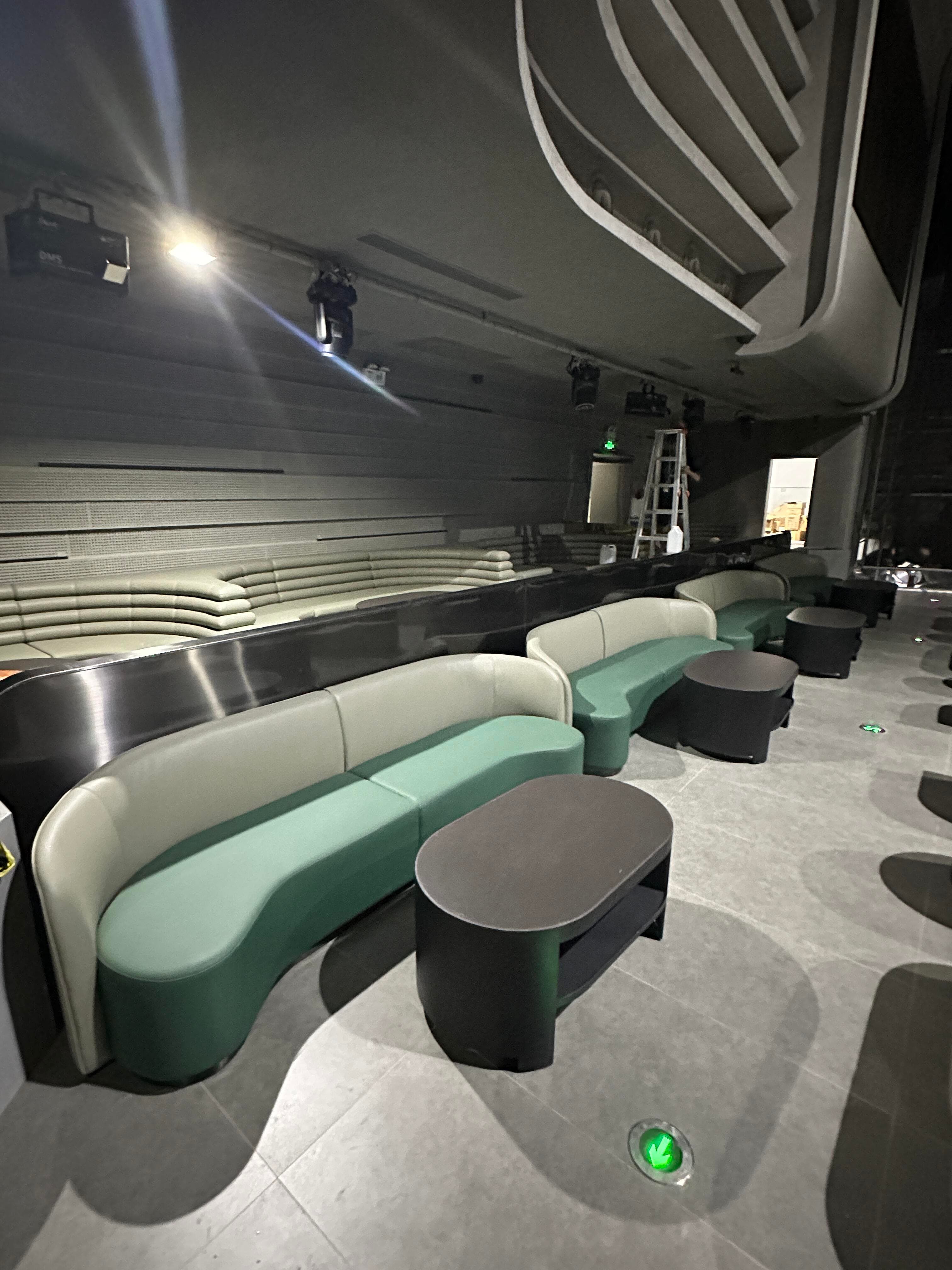 XIANG LIVESHOW side seating aisle with layered perforated acoustic wall panels