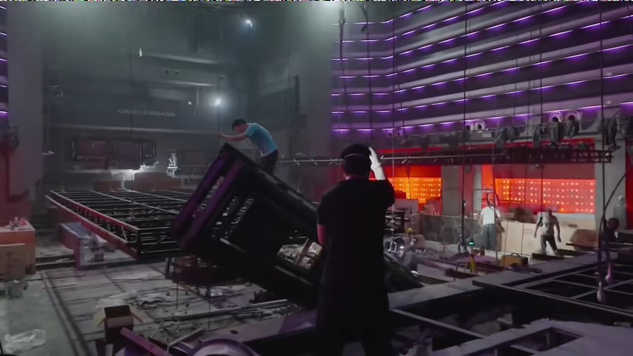 XIANG LIVESHOW construction phase with stage grid structure, exposed wiring, and equipment installation