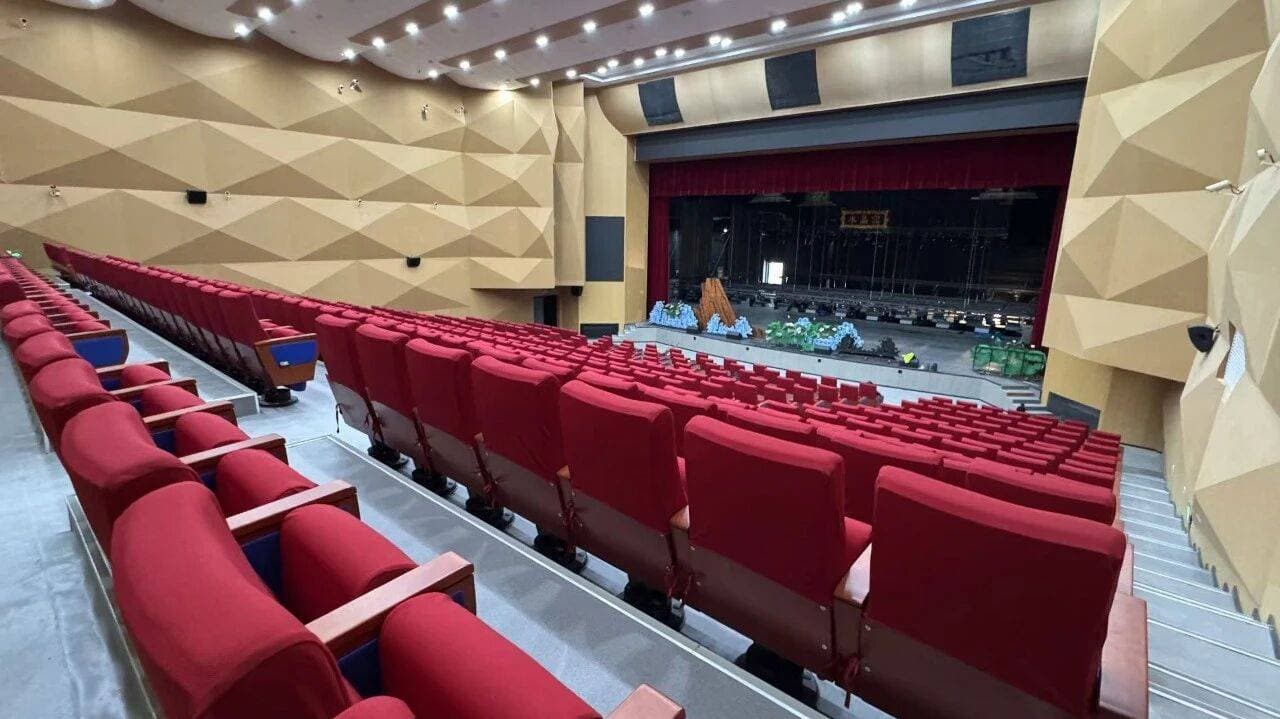 Shule Performing Arts Center audience seating and stage from side aisle