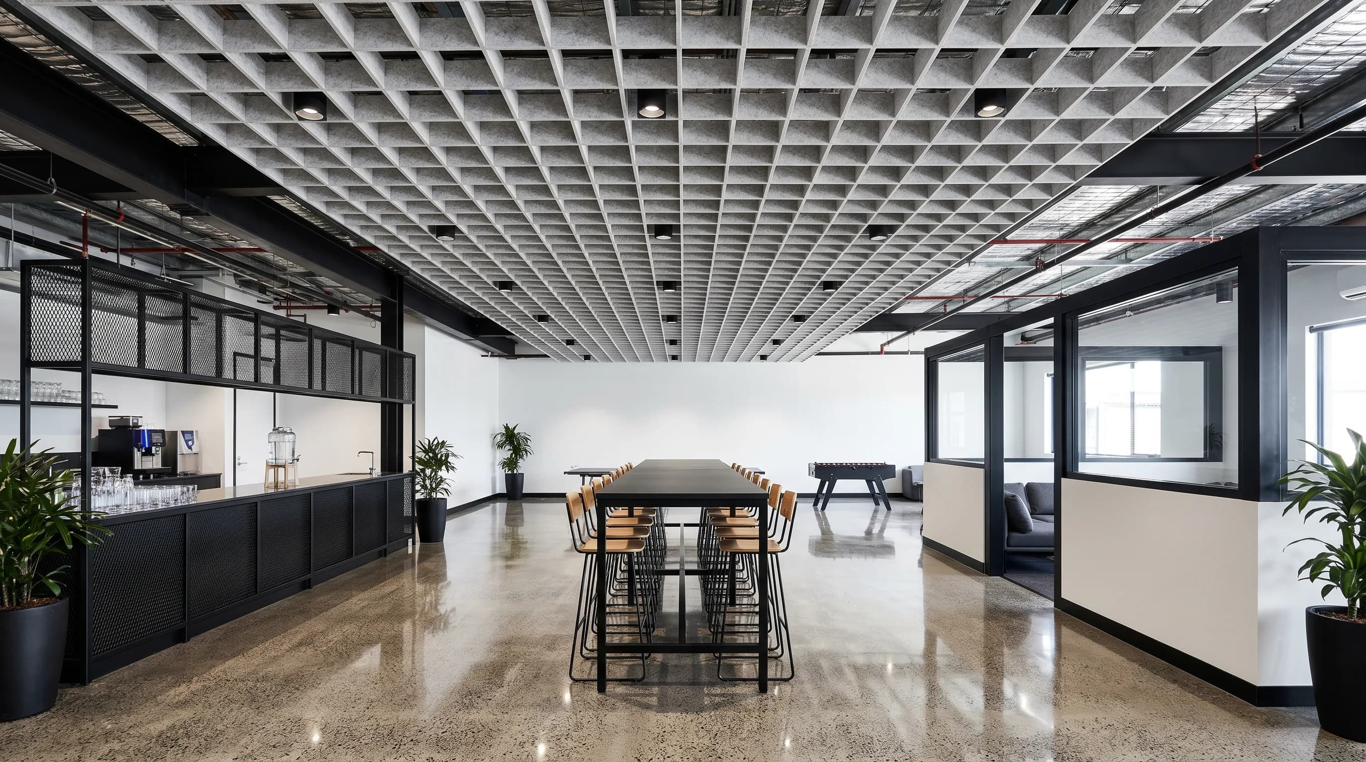 Open workstation area with suspended acoustic grid baffles